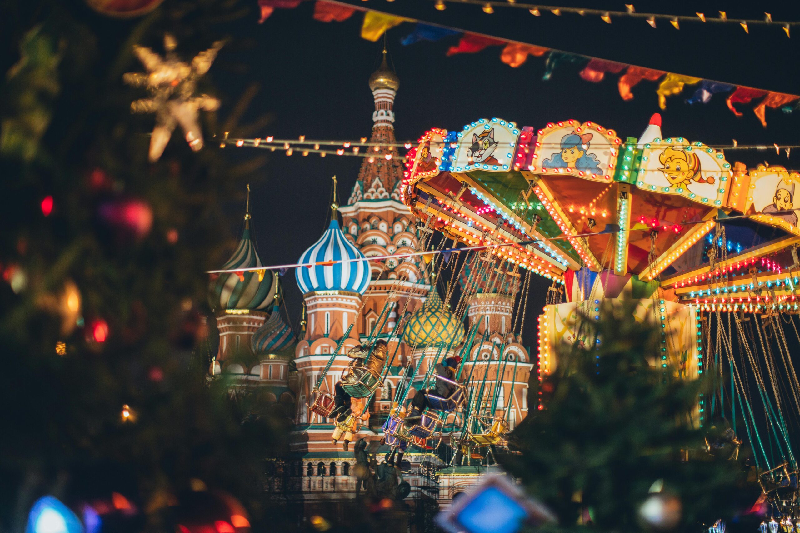 Colorful Christmas fair at St. Basil's Cathedral, Moscow during winter night.